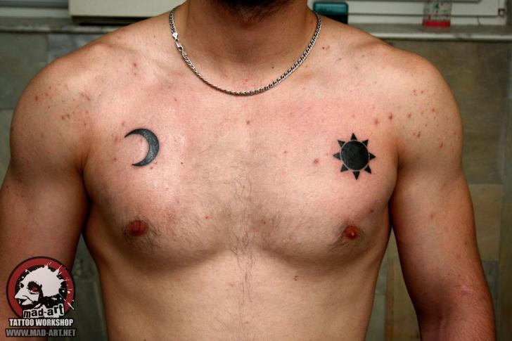 A Man Amp 39 S Chest With A Sun And Moon Tattoo On The Side Of His Stomach