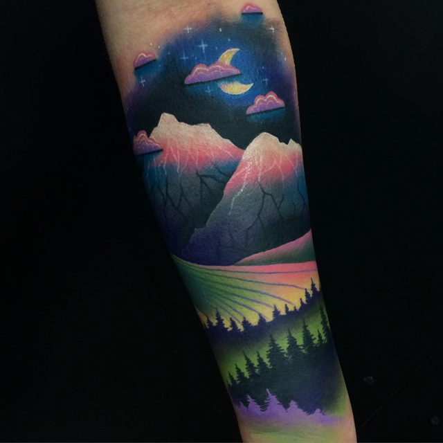 A Man S Arm With A Mountain Landscape Tattoo On It