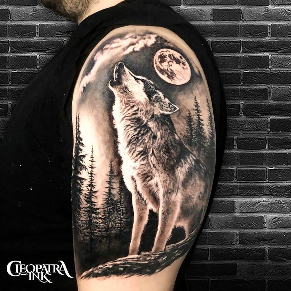 A Man S Arm With A Wolf Tattoo On It And Trees In The Background