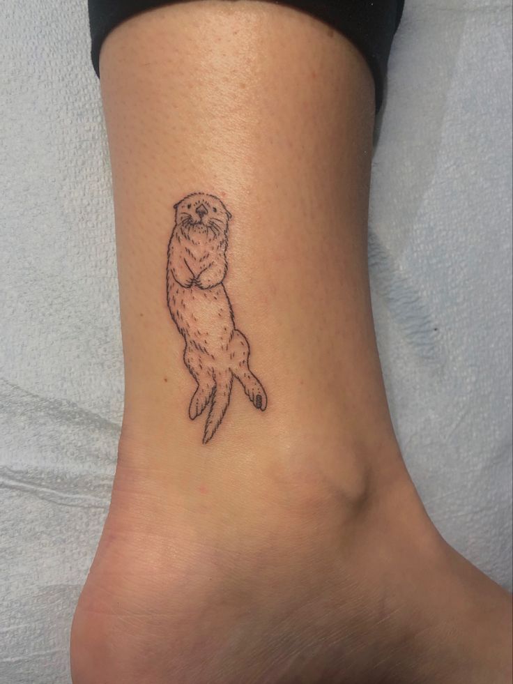 Adorable Sea Otter Tattoo