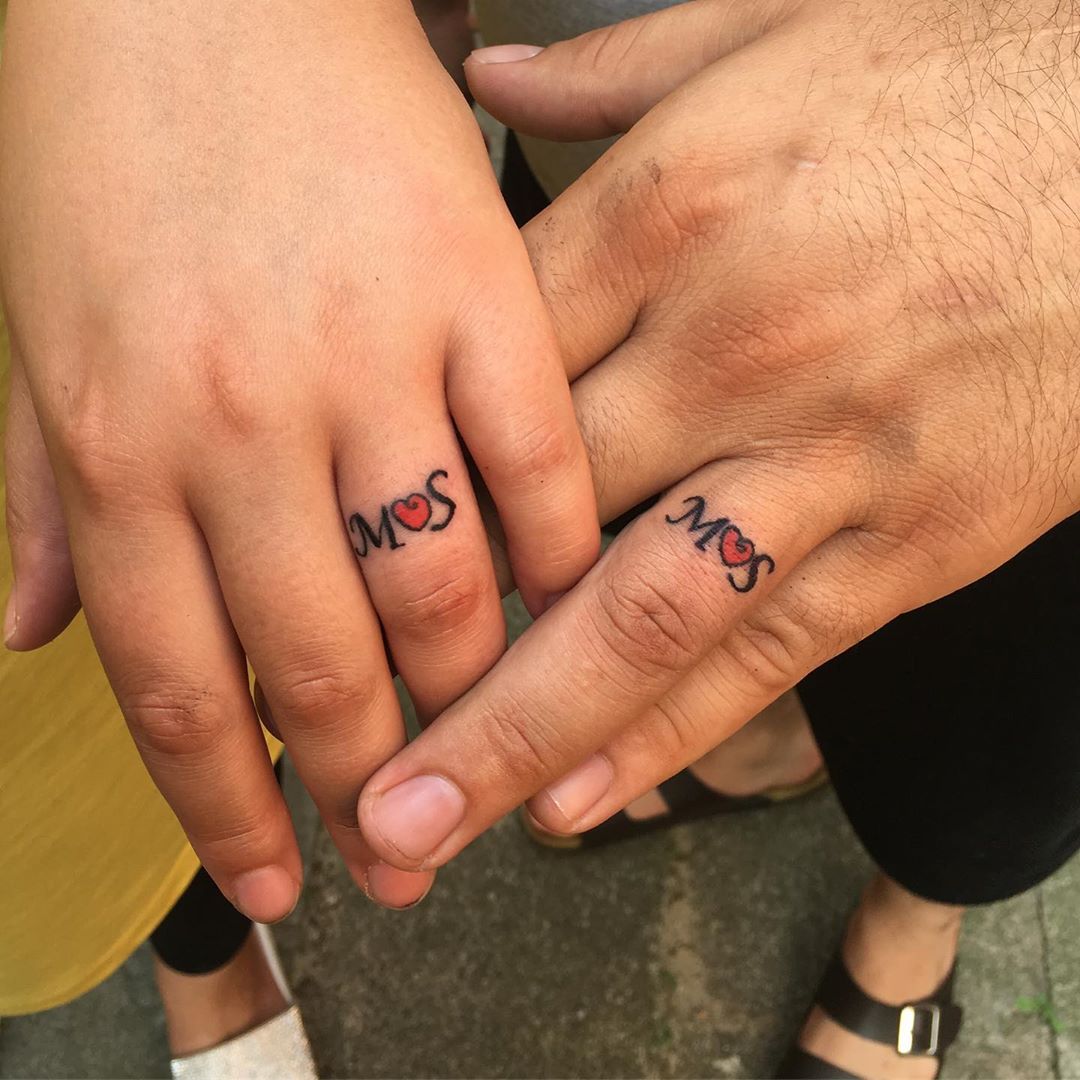 Dazzling Matching Tattoos Connected By Heart Blurmark