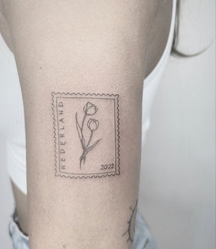 Fine Line Stamp Tattoo Placed On The Bicep