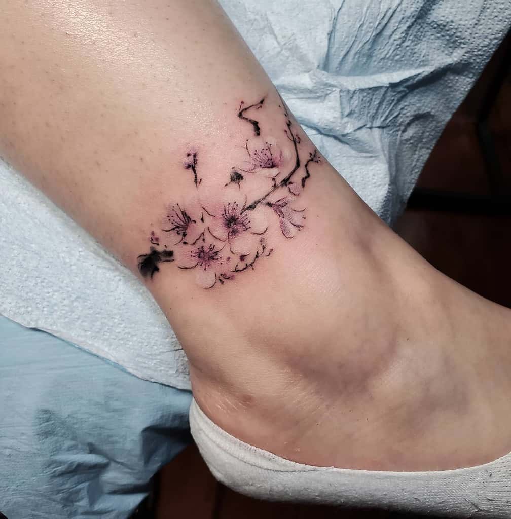 20 Small Flower Foot Tattoo Designs for Elegance