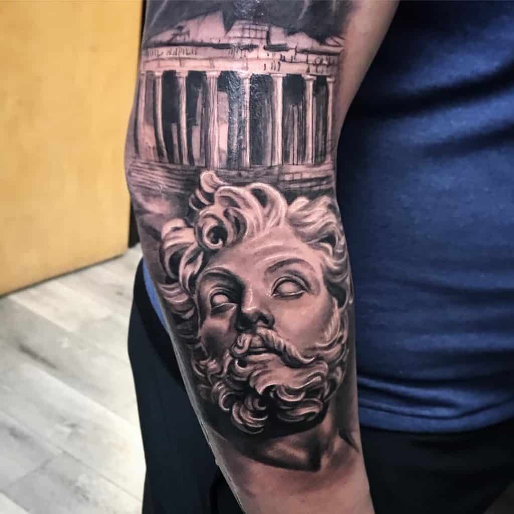 5 Stunning Statue Tattoo Designs You'll Love