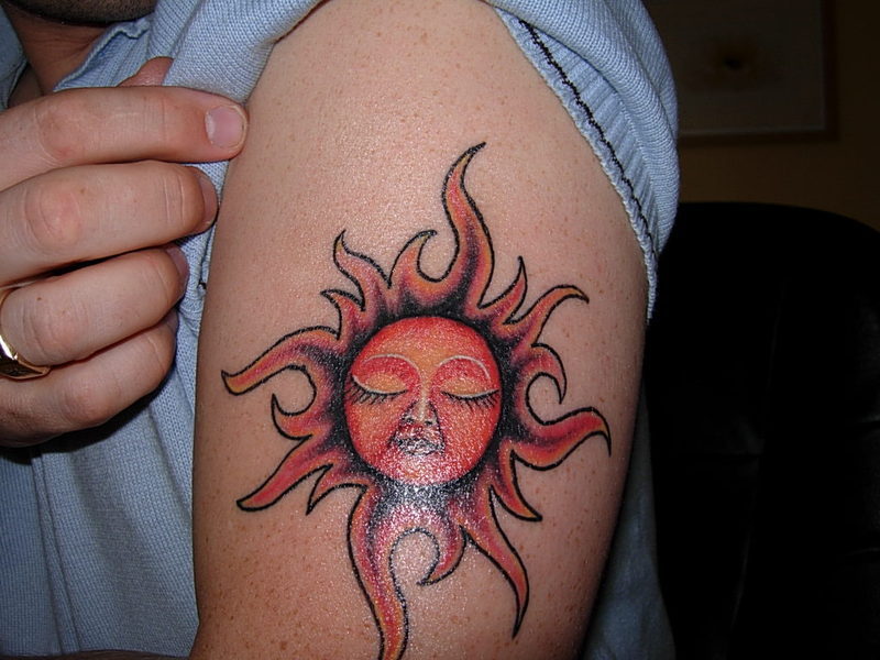 10 Stunning Sun Face Tattoo Designs You'll Love