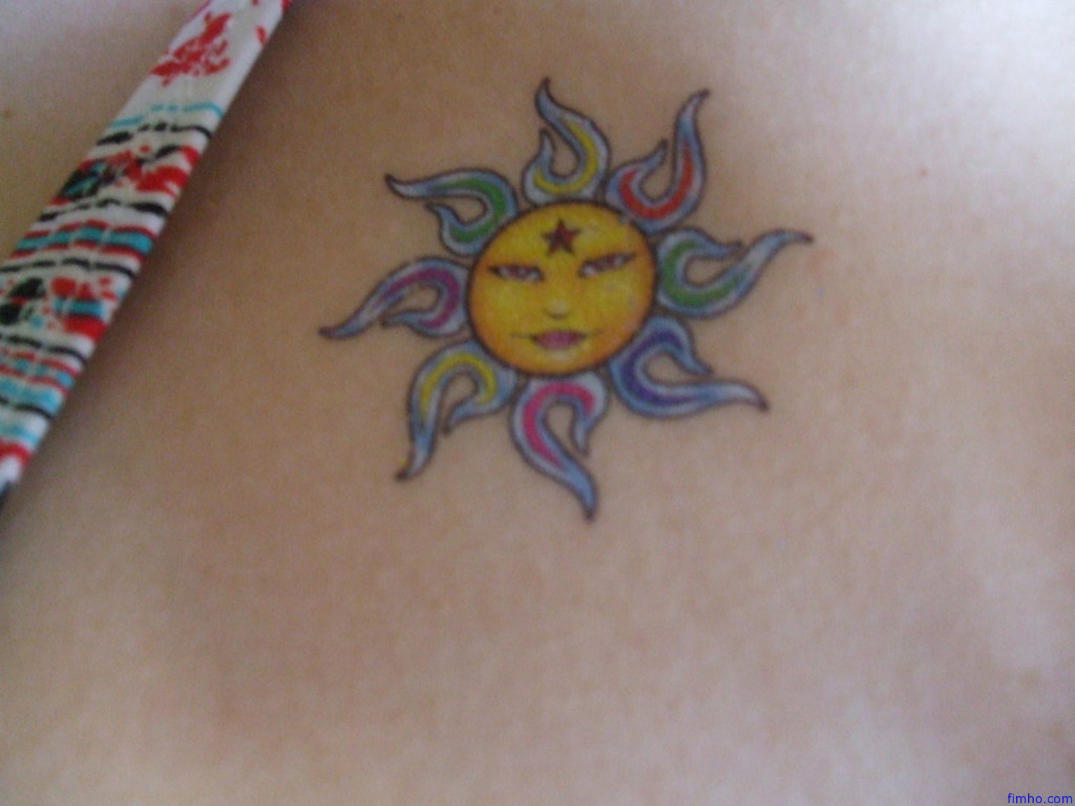 Traditional Sun Tattoo On Thigh Sun Tattoos Arrow Tattoos Feather